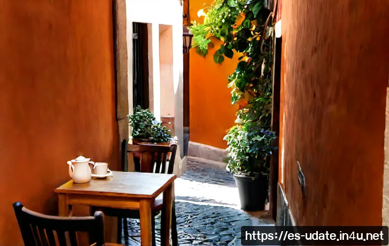 숨은 감성 카페 탐방 - Photorealistic hidden neighborhood café in a narrow cobblestone street in Madrid, warm terracotta wa...
